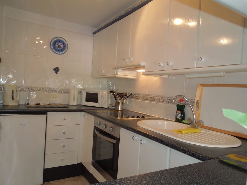 Fully equipped kitchen with all appliances