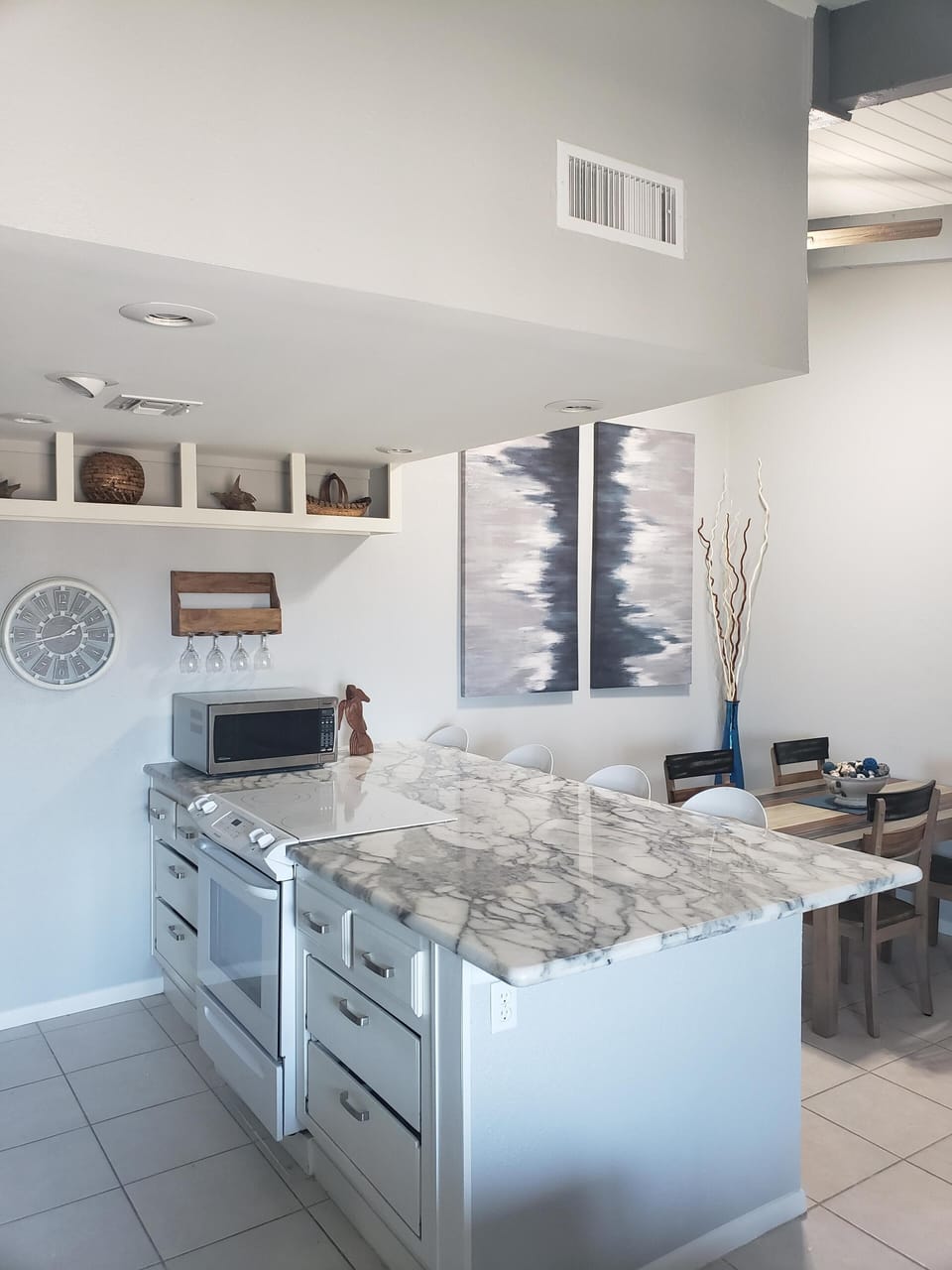 Kitchen has stove top, oven, microwave, dishwasher and full size refrigerator