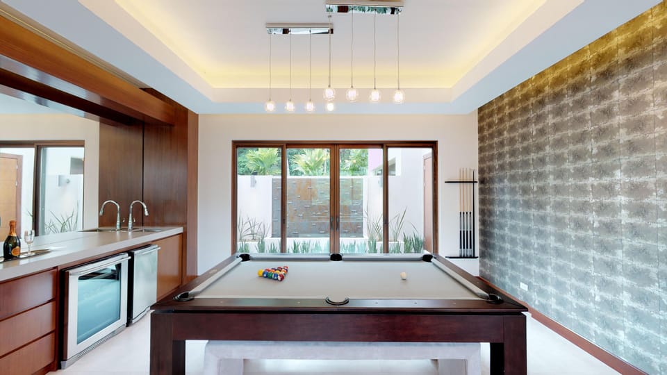 Pool table and bar. Pool table can be transformed to dinner table.