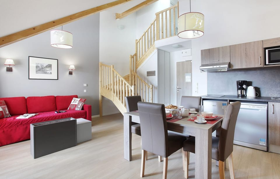 This attractive residence has been built in an elegant, traditional style using wood and stone accents to blend in with its stunning surroundings