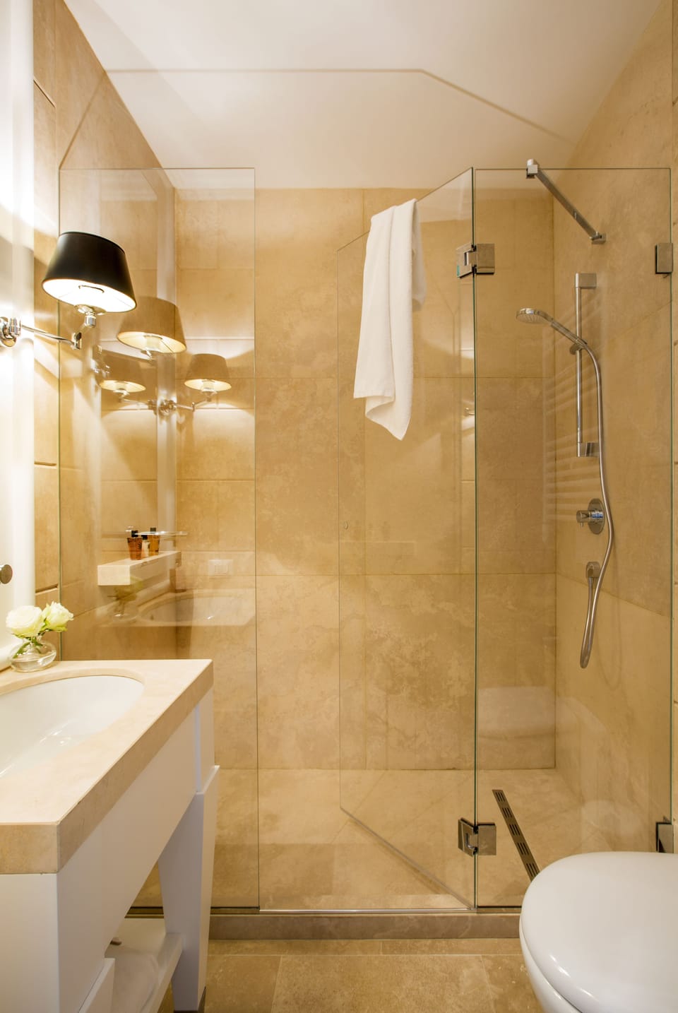 Shower, designer toiletries, hair dryer, slippers