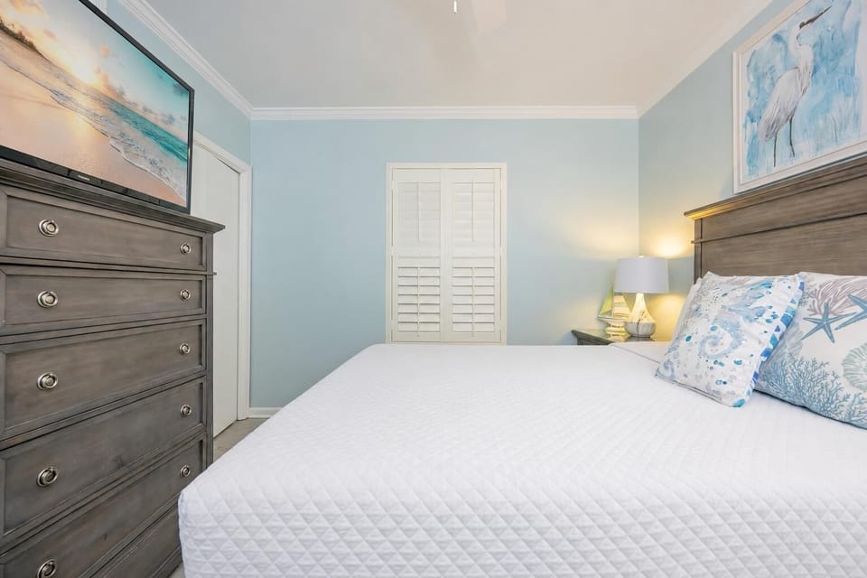 Beach-inspired art enhances the guest suite while you relax and stream your favorite show on the TV