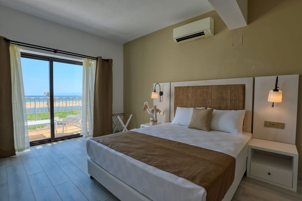 Standard Triple Room, Sea View | Premium bedding, minibar, in-room safe, blackout drapes