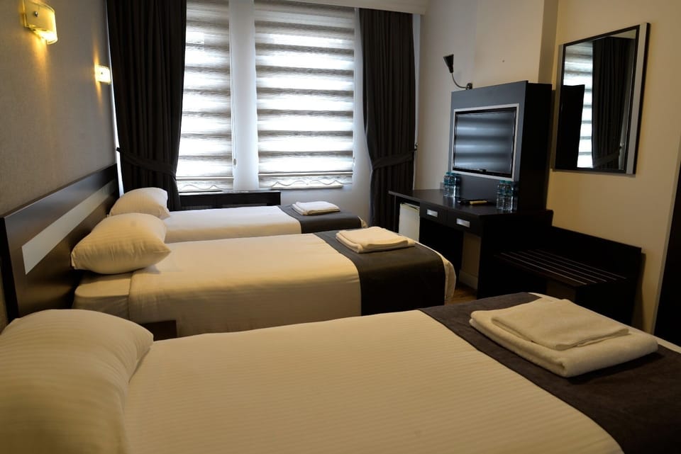 Basic Triple Room | Egyptian cotton sheets, premium bedding, memory foam beds, desk