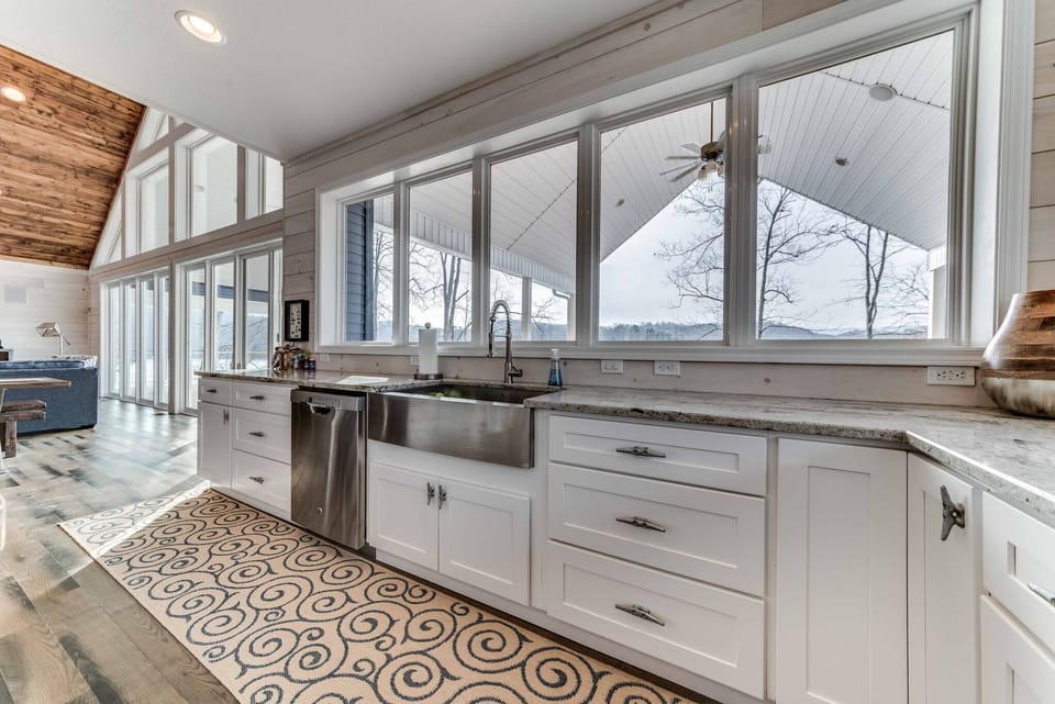 A kitchen with a view of the lake