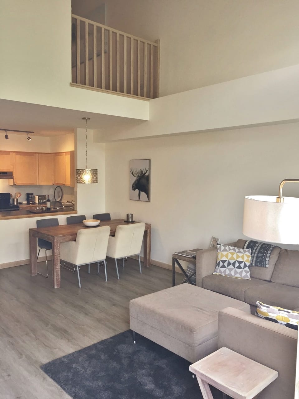 Living area with a peek at the half open loft master bedroom.