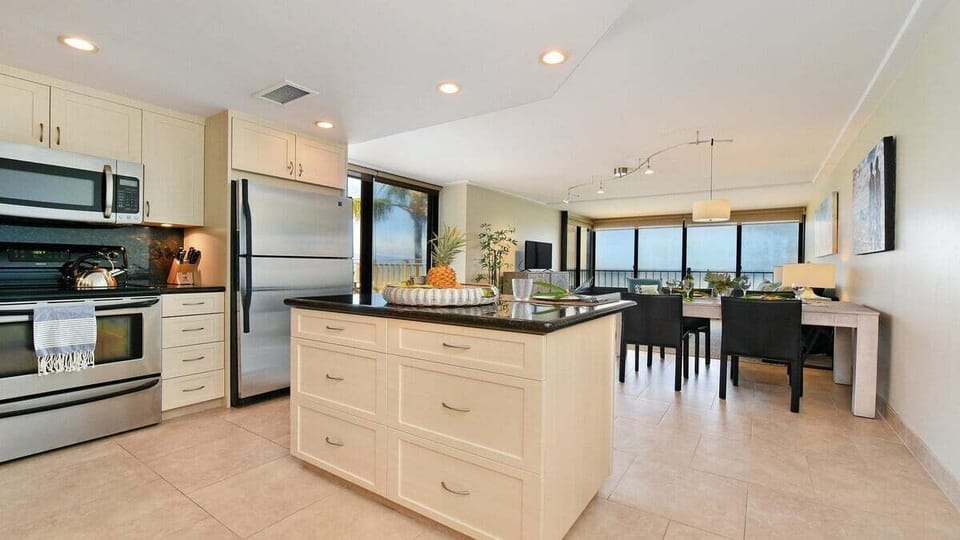 Open-concept living and dining area with private roof deck access