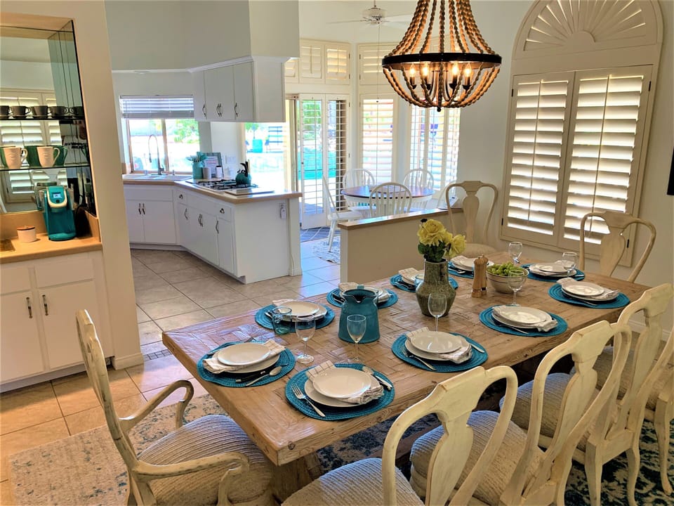 Dining room adjacent to nook and kitchen with a beautiful pool view!