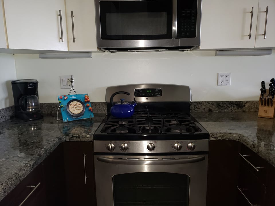 Gas stove and oven.  Large microwave oven 