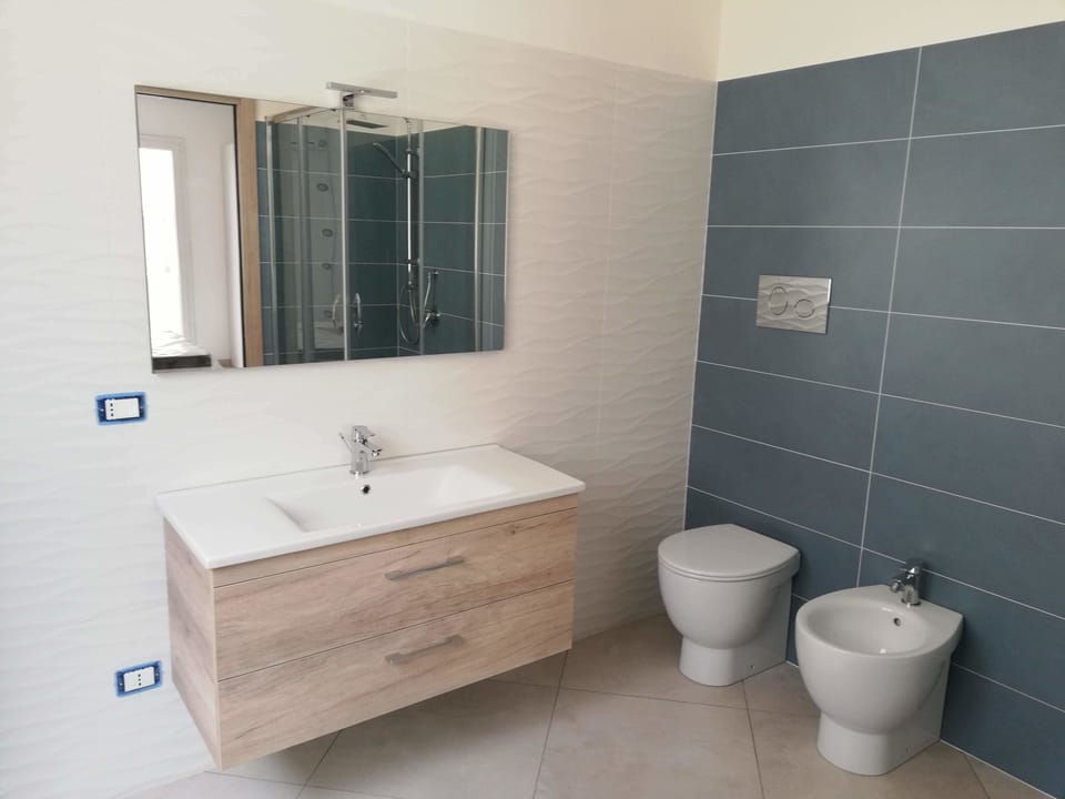 Premium Double Room, Balcony, City View | Bathroom | Shower, rainfall showerhead, free toiletries, hair dryer