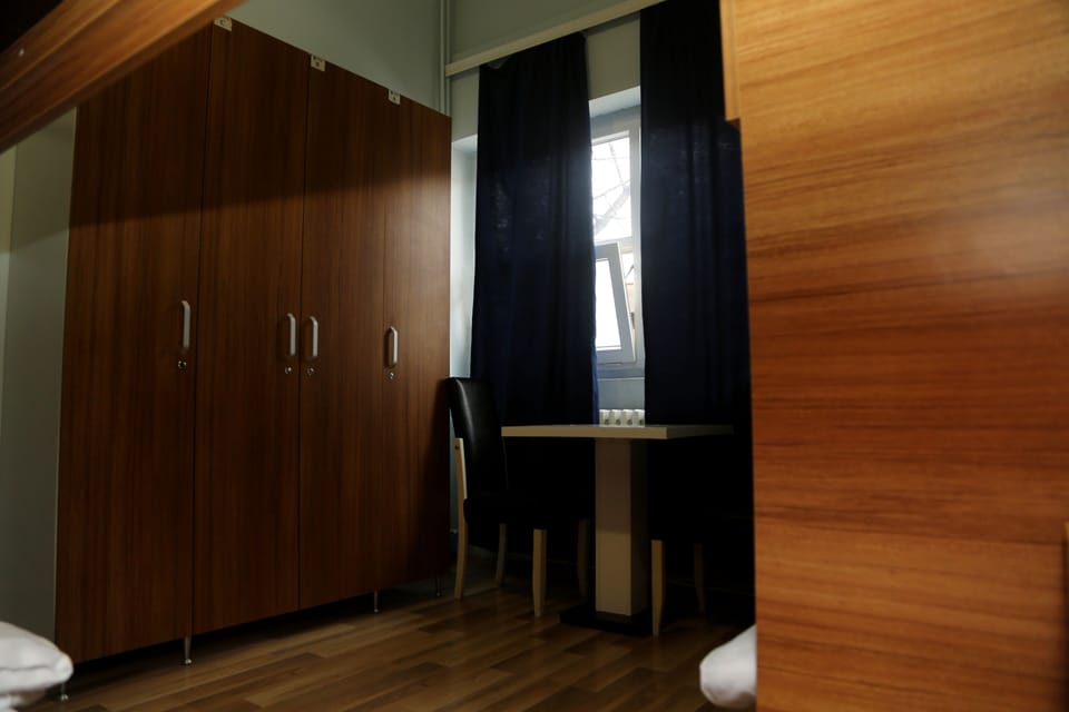 Down comforters, desk, laptop workspace, iron/ironing board