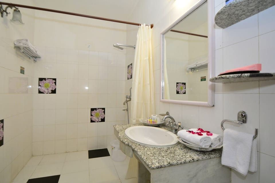 Shower, free toiletries, slippers, towels