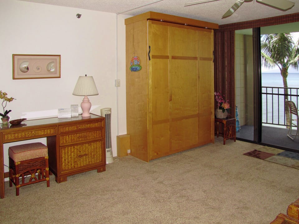 Queen Murphy bed folded up during day.  Desk for your laptop to us free WiFi 
