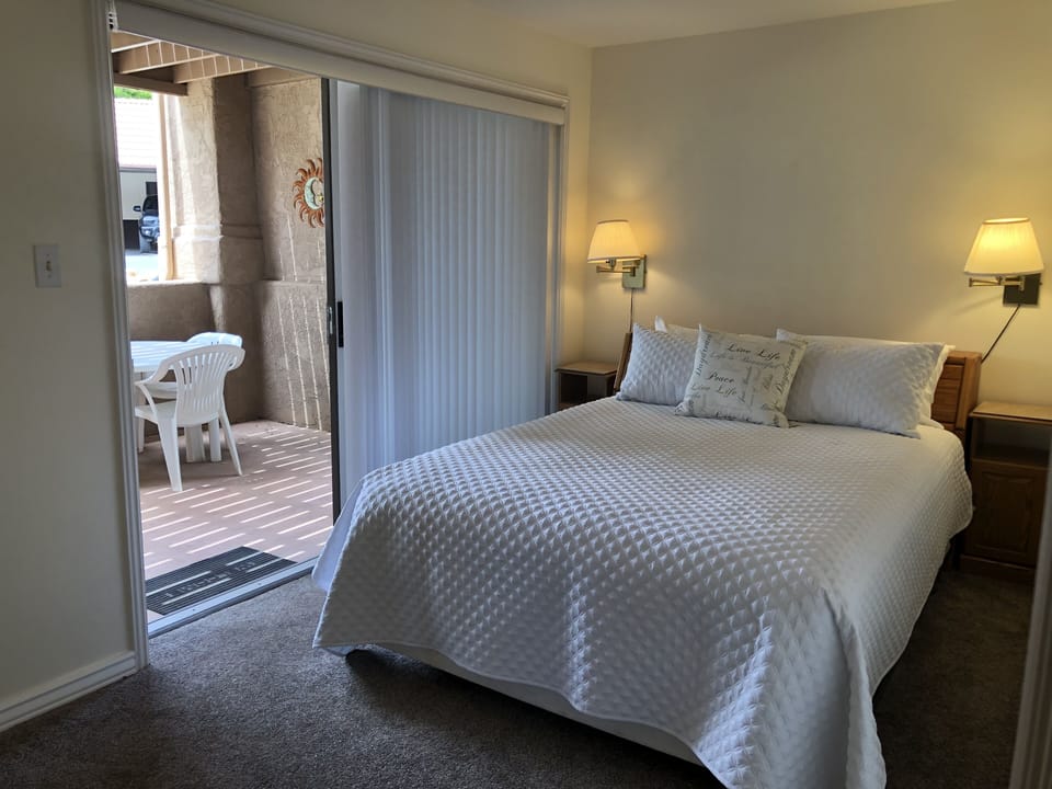 2nd bedroom with view to private patio