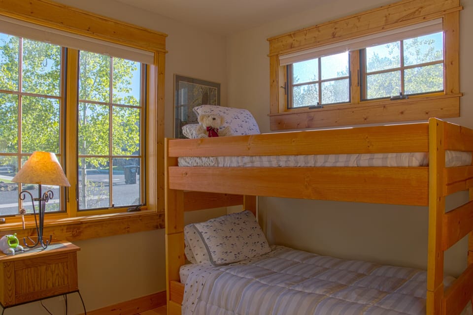 Sleep easy in the bunk room featuring three twin beds