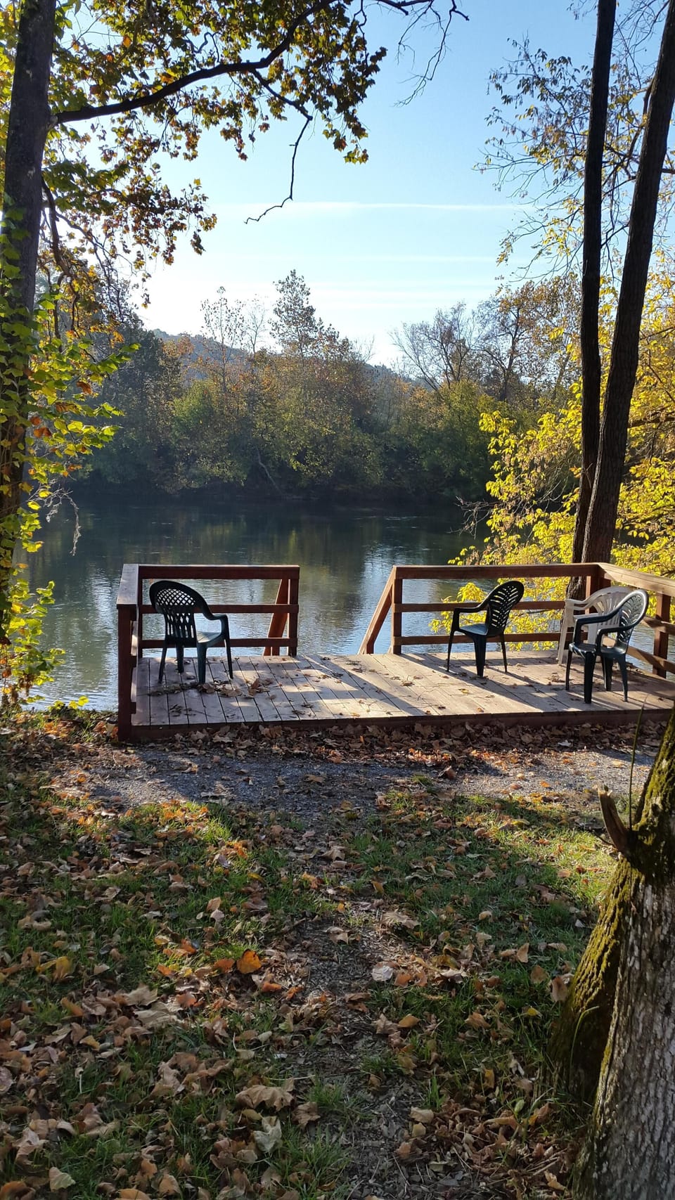 Our deck - steps take you down to a swimming hole or can fish from bank...