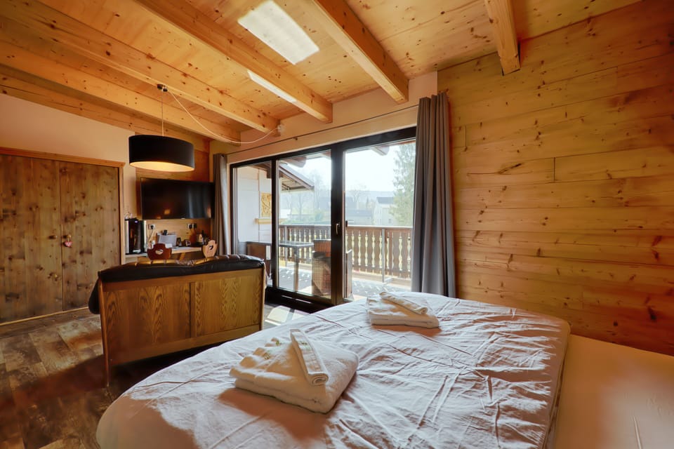 Deluxe Double Room, Sauna, Mountain View | In-room safe, individually decorated, desk, blackout drapes