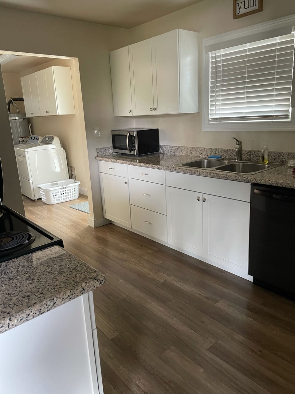 Kitchen area and entrance into the laundry room. 