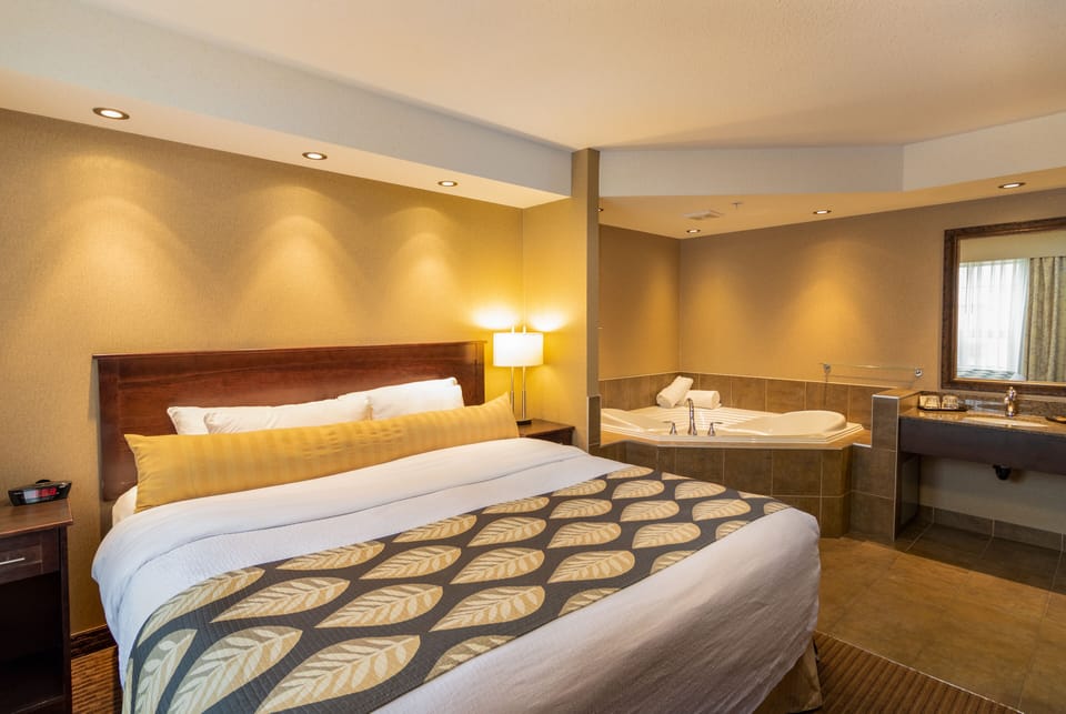 Suite, 1 King Bed, Jetted Tub | Premium bedding, pillowtop beds, desk, blackout drapes