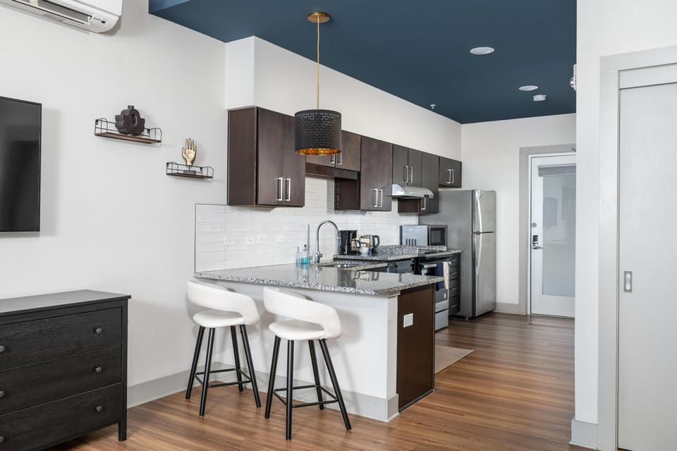 Modern kitchen with cozy breakfast bar and sleek appliances