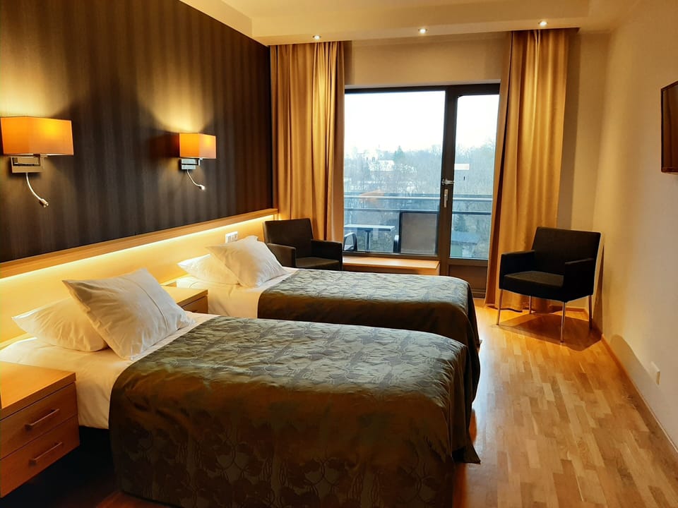 Superior Twin Room, Balcony | Living area | 26-inch flat-screen TV with cable channels, TV