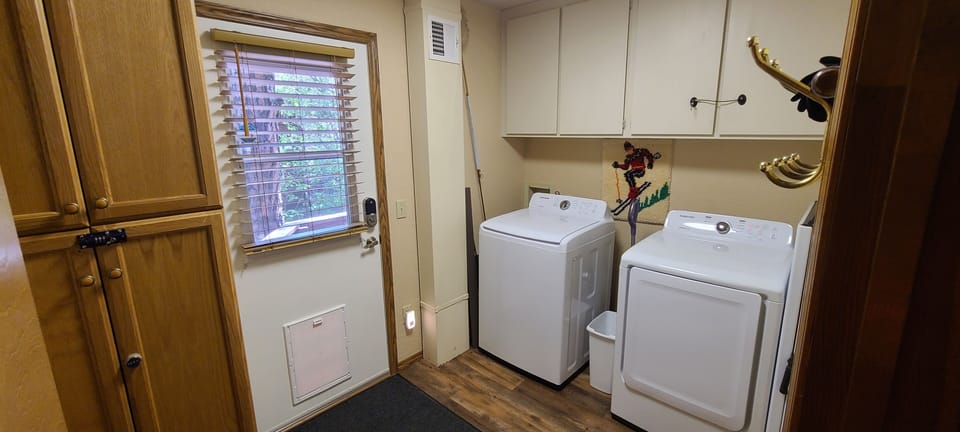 Laundry room, washer & dryer. Pantry cabinet with additional cooking appliances.