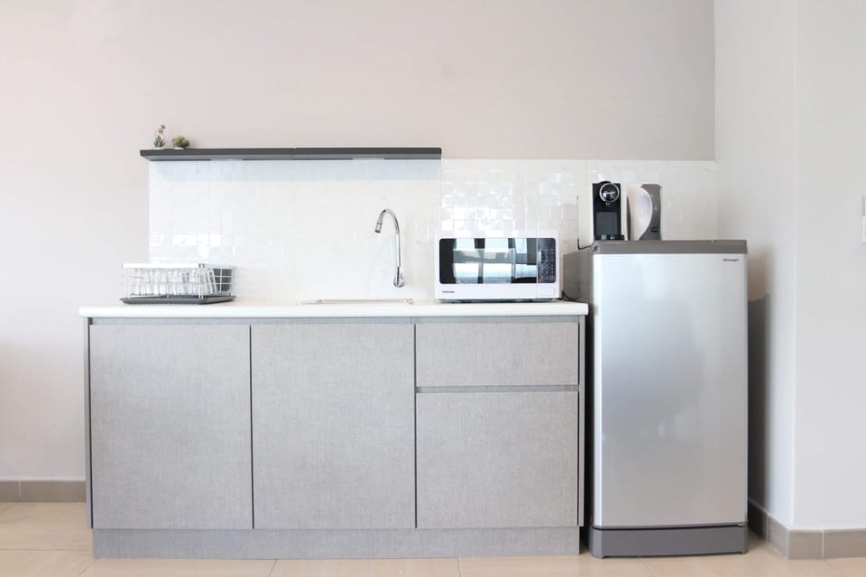 Exclusive Apartment | Private kitchen | Full-size fridge, electric kettle