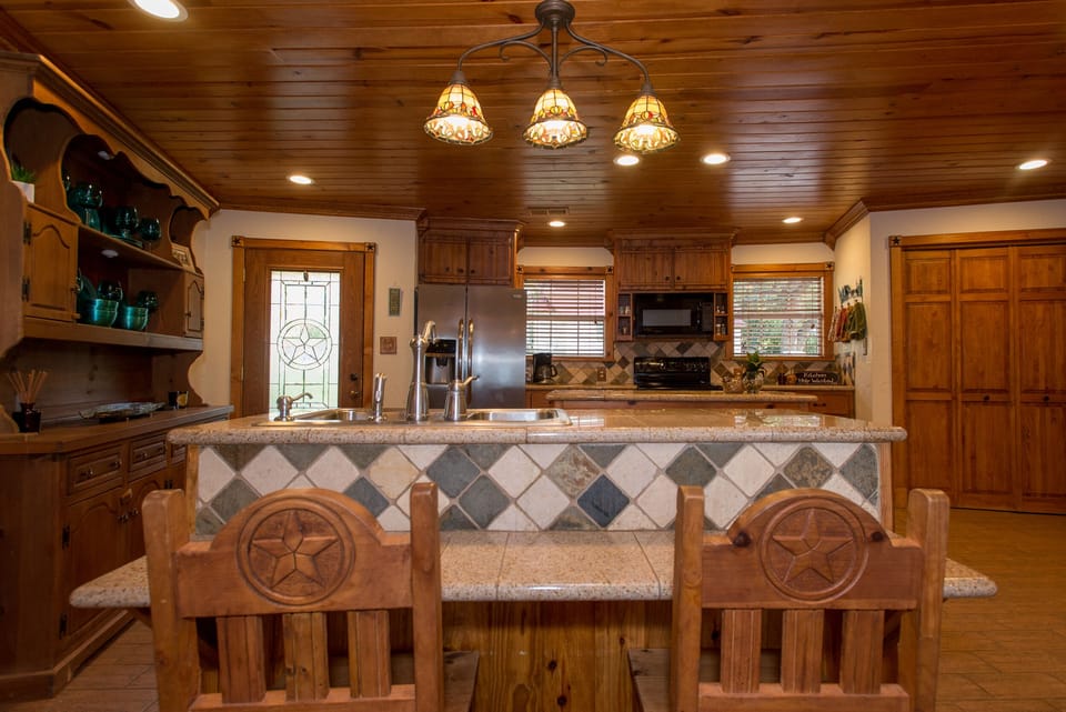 Look at this gorgeous kitchen. You'll want to cook every meal while on vacation!