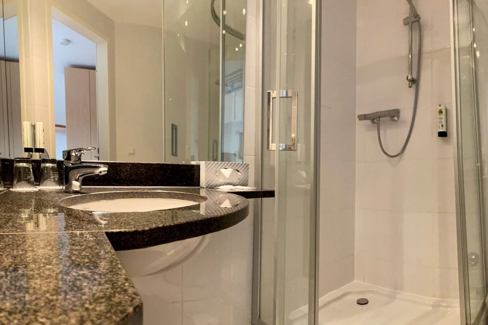 Separate tub and shower, free toiletries, hair dryer, heated floors