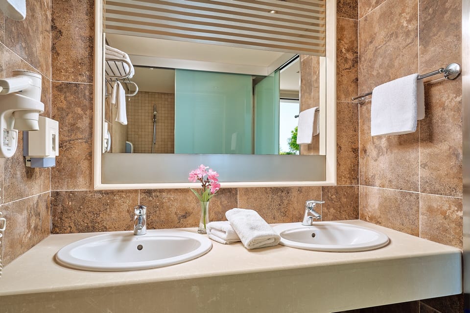 Shower, eco-friendly toiletries, towels, soap