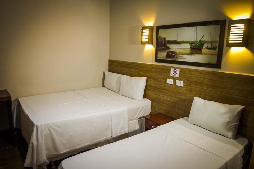 Triple Room | Minibar, blackout drapes, free WiFi, bed sheets