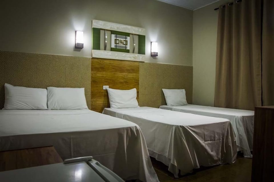 Triple Room | Minibar, blackout drapes, free WiFi, bed sheets