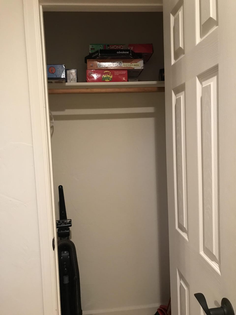 Coat closet with board games.