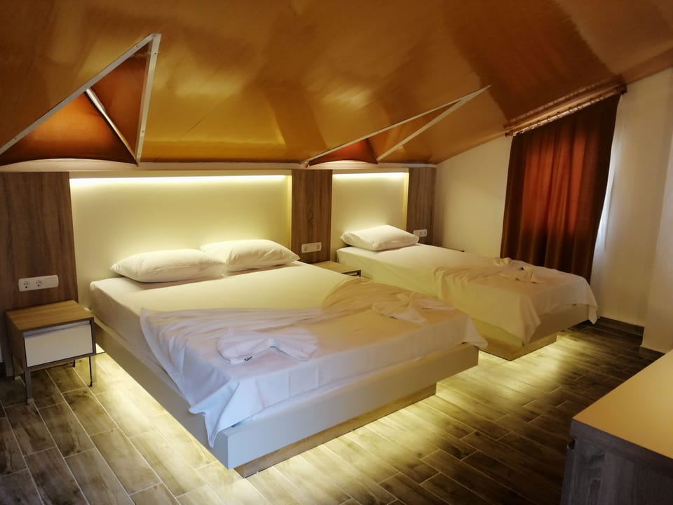 Standard Triple Room | Minibar, iron/ironing board, free WiFi, bed sheets