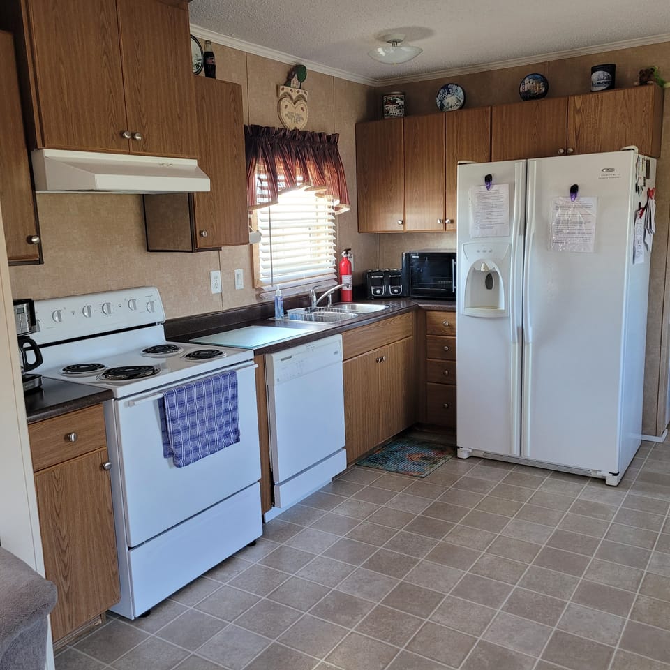 Kitchen with utensils. Not able to use the dishwasher.