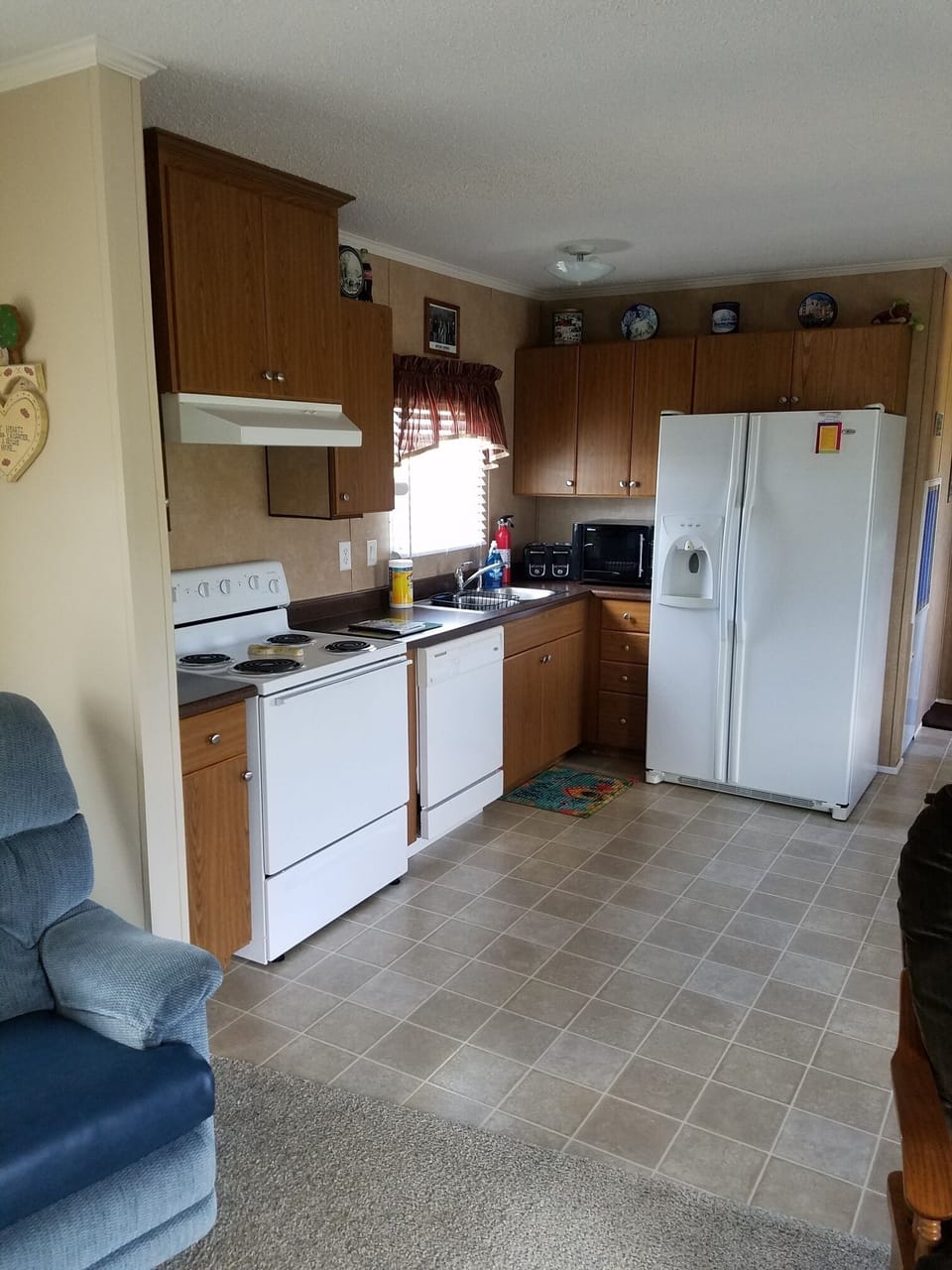 Kitchen with utensils. Dishwasher not hooked up.