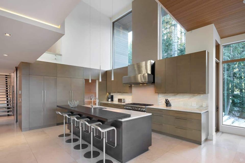 - Sleek contemporary kitchen featuring long marble island and designer stools  
- Fully equipped with premium appliances and spacious layout  
- Ideal for cooking family meals before hitting the mountain trails  
