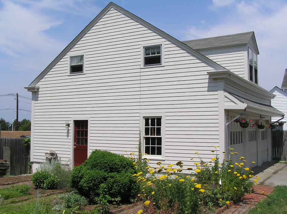 Enter the Sailor's Loft through the red door in the perennial garden.