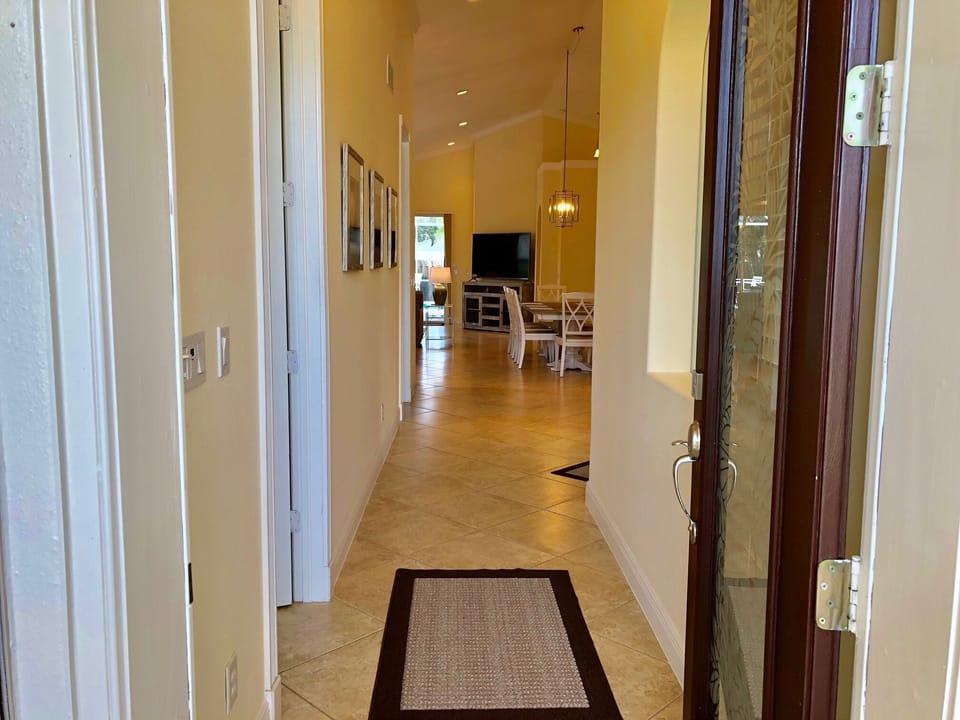 Spacious entrance foyer with two twin bedrooms on left.