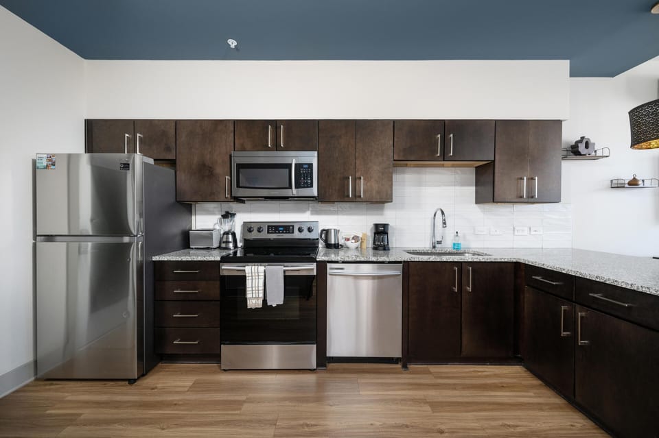 Modern kitchen with sleek stainless steel appliances and ample storage