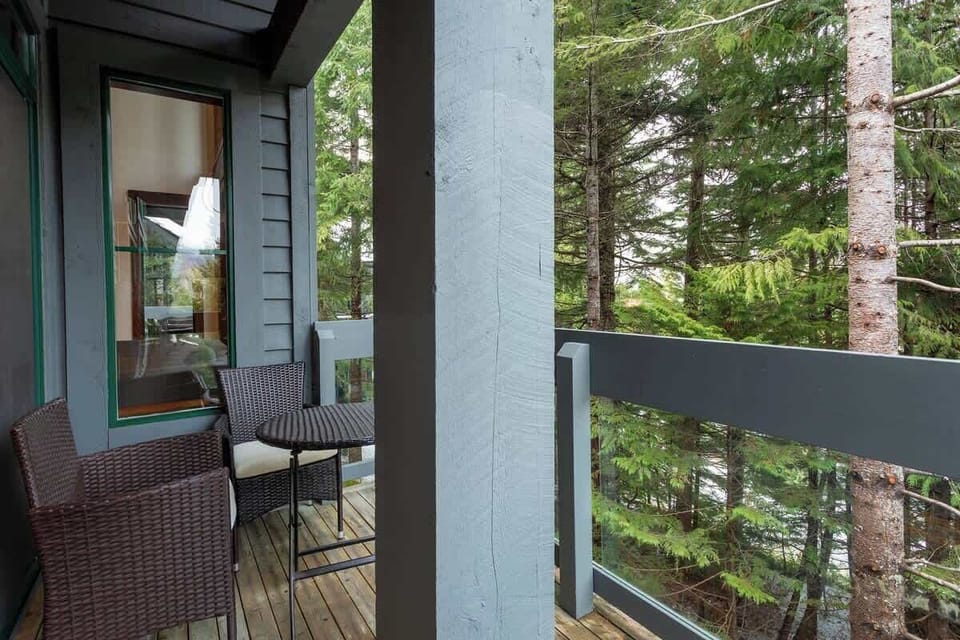 - Forest-view balcony with seating for morning coffee or evening wine  
- Surrounded by evergreens offering privacy and serenity  
- Peaceful outdoor escape steps from your bedroom  