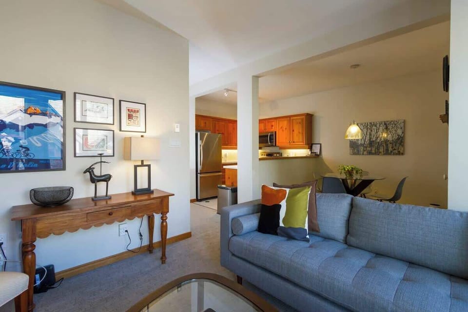 - Open-concept living area with kitchen and dining flow  
- Whistler condo featuring bright design and home comfort  
- Modern furnishings with mountain-inspired aesthetic charm  

