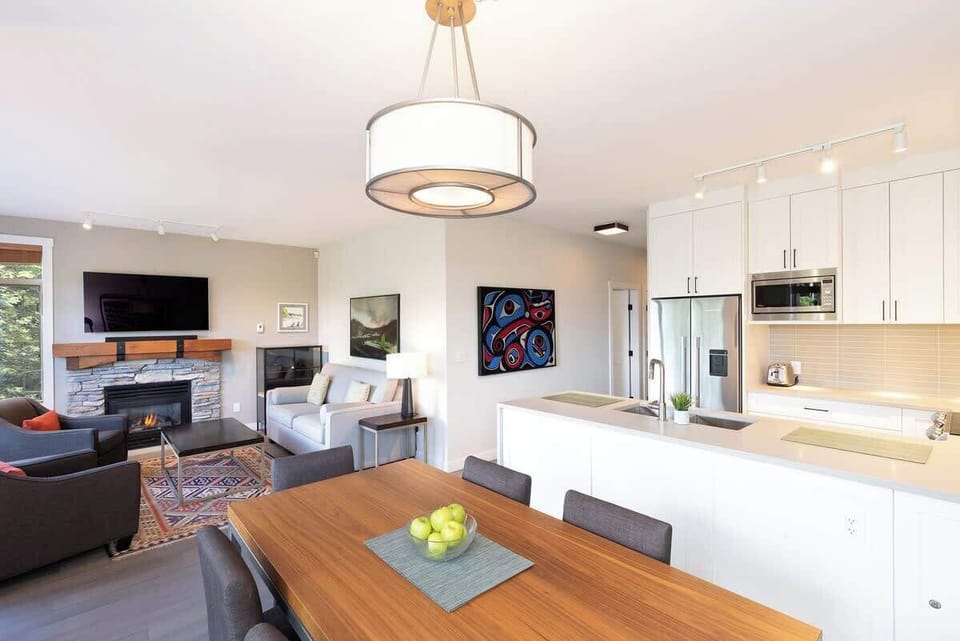 - Open-plan Whistler dining kitchen and living retreat  
- Stainless appliances and stylish wood accents glow  
- Perfect for family gatherings and alpine comfort  
