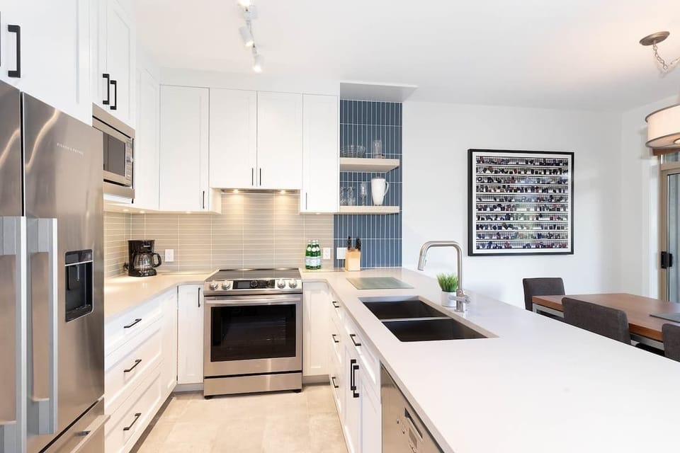 - Modern Whistler kitchen with sleek bright design  
- Fully equipped with high-end appliances and style  
- Ideal for home cooking in your mountain getaway  