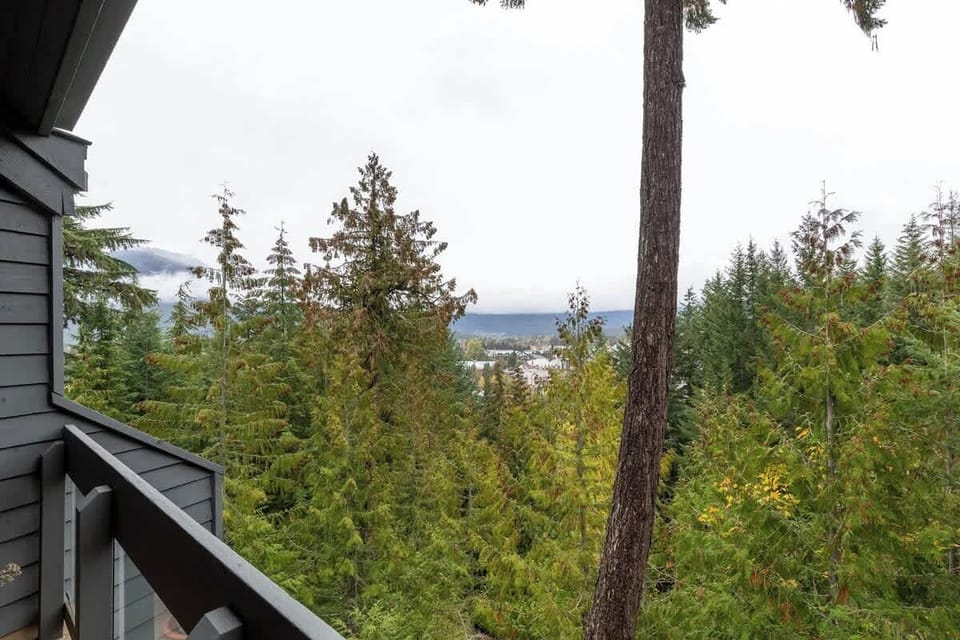 - Balcony view overlooking lush evergreens and mountain valley below  
- Breathe in crisp Whistler air and watch morning fog drift over peaks  
- Perfect peaceful moment to start your alpine adventure days  
