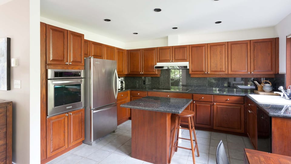 - Gourmet kitchen with granite island and wood cabinets  
- Fully equipped space for group cooking adventures  
- Stainless steel appliances with modern alpine touch  
