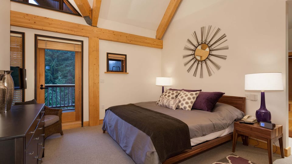 - Master bedroom with king bed and plush linens for restful mountain nights  
- Private balcony offering forest views and crisp Whistler air  
- Modern comfort meets rustic wood design for ultimate relaxation  