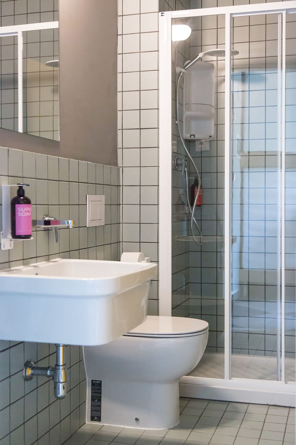 Shower, rainfall showerhead, hair dryer, towels