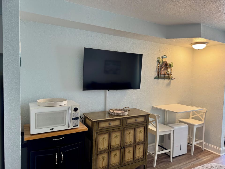 Cart with microwave, dresser, 50” Smart Tv
