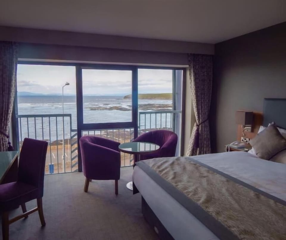 Desk, laptop workspace, blackout drapes, iron/ironing board